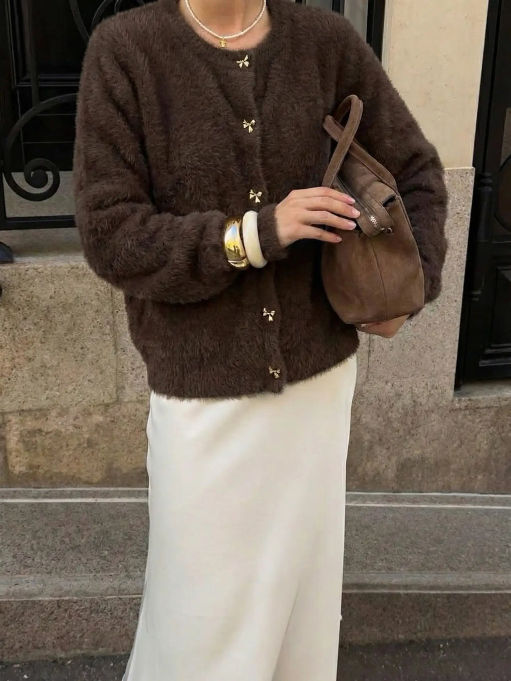 Zacht bruin vest knopen strikmotief